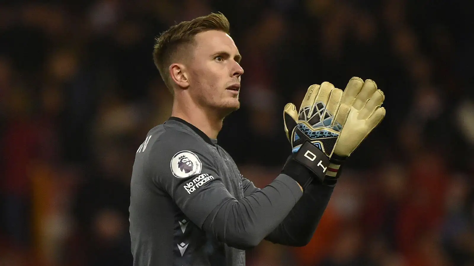 Nottingham Forest's goalkeeper Dean Henderson applauds the fans at the end of the English Premier League soccer match between Nottingham Forest and Aston Villa at the City ground in Nottingham, England