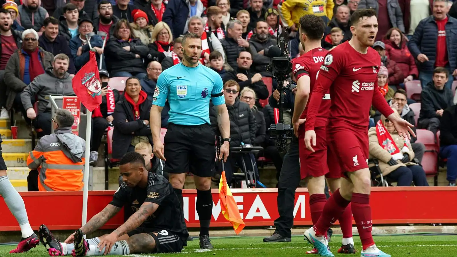 Liverpool defender Andy Robertson looks unhappy as he walks away from an incident