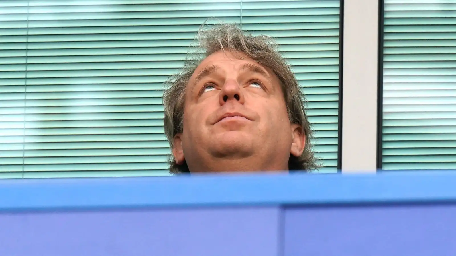 Chelsea owner Todd Boehly looks up above
