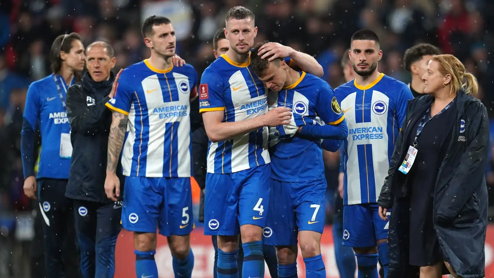 Brighton players console Solly March after his decisive penalty miss in the FA Cup semi-final against Manchester United
