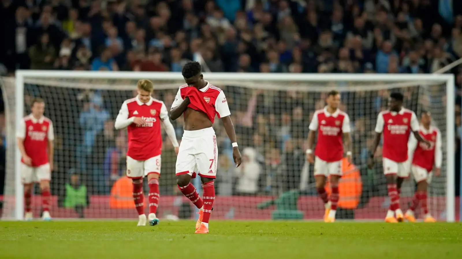 Arsenal players look dejected after conceding a goal