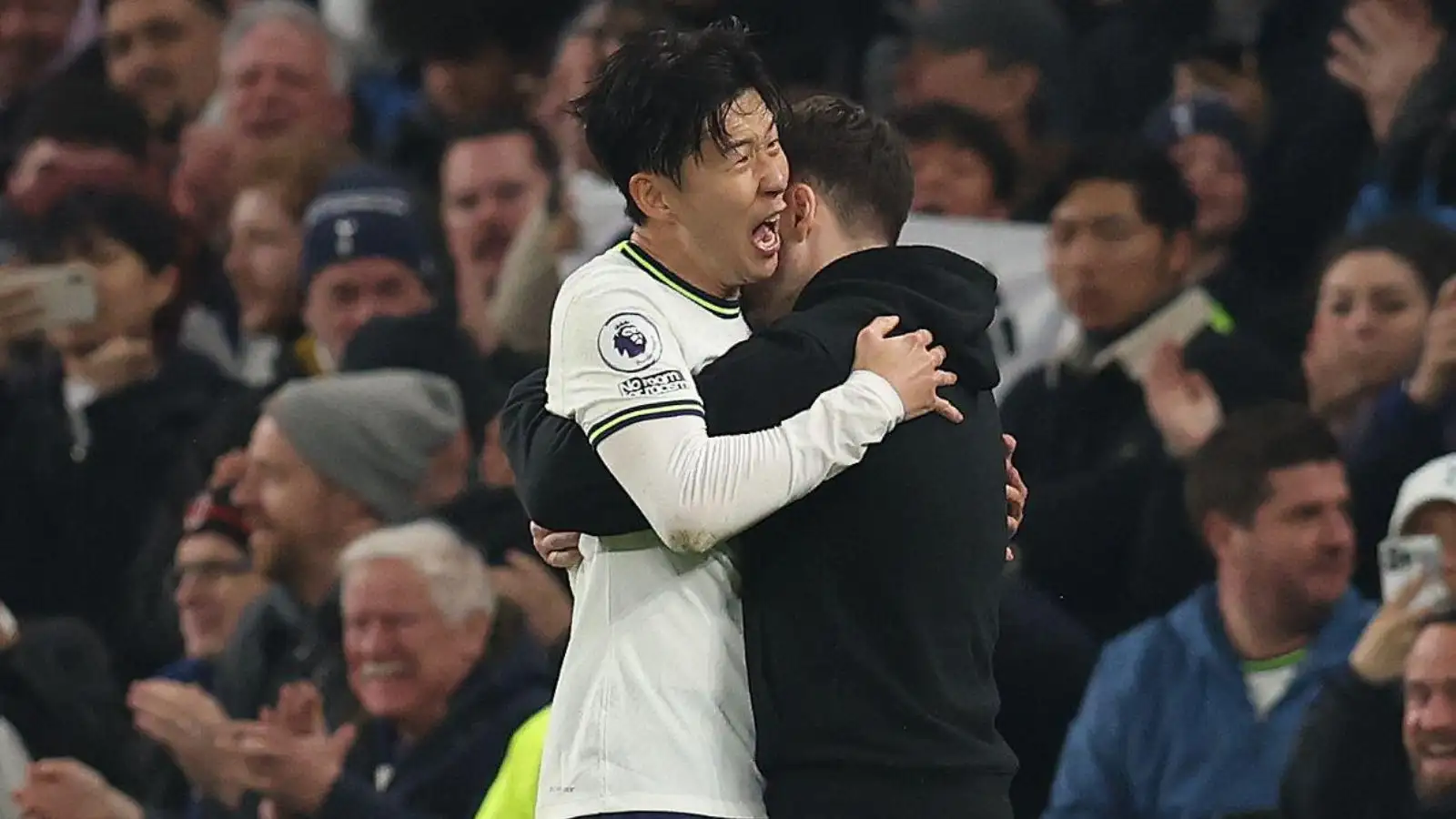 Tottenham forward Son Heung-min hugs Ryan Mason