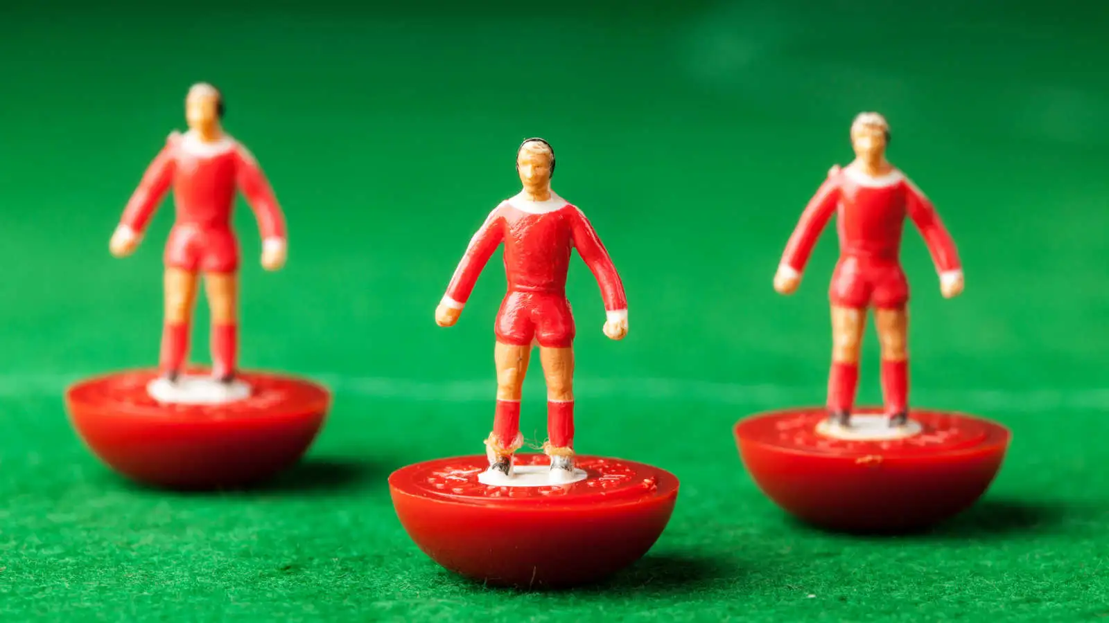 Subbuteo players lined up on a pitch