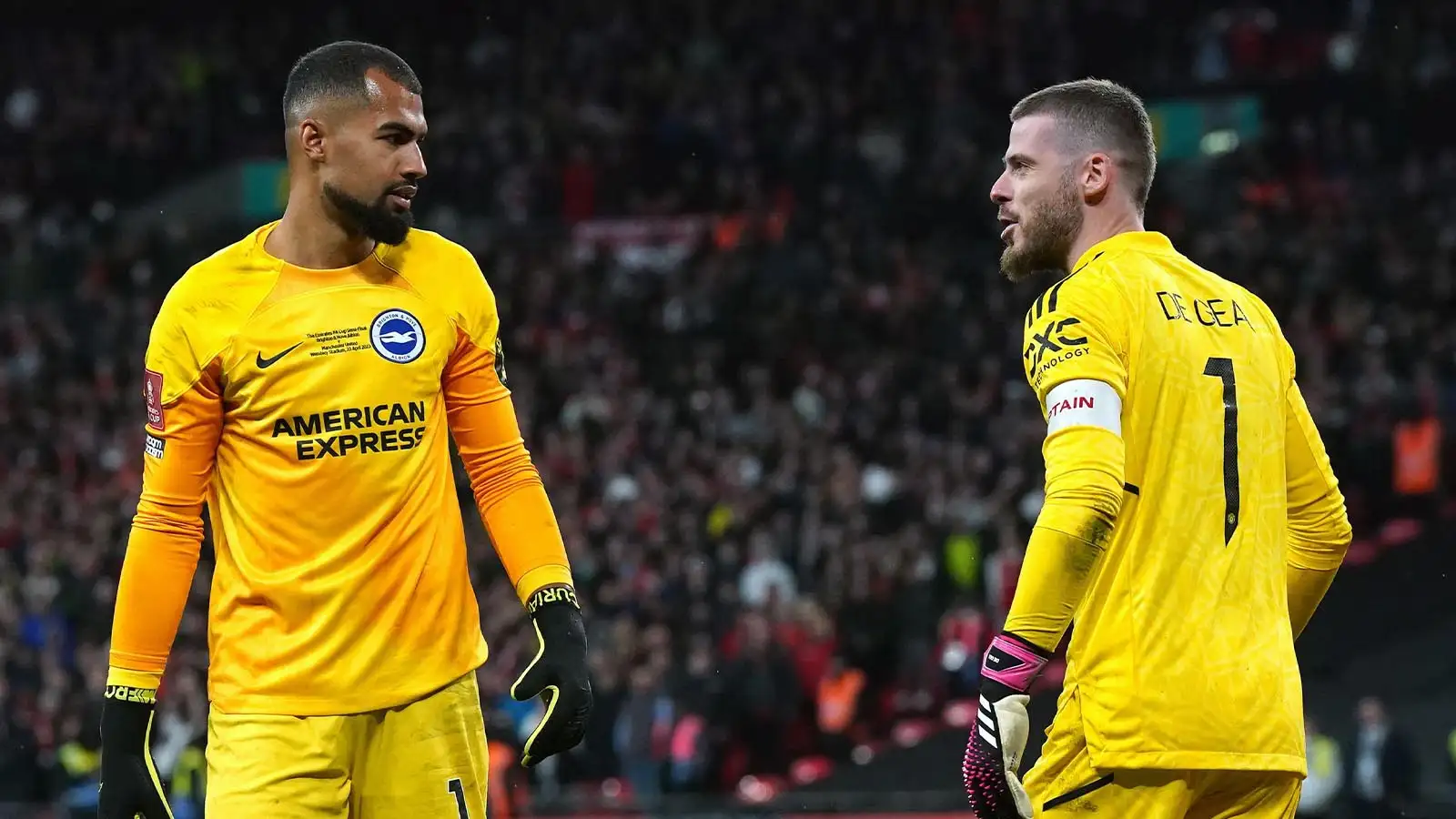 Brighton and Hove Albion goalkeeper Robert Sanchez and Manchester United goalkeeper David de Gea speak in the penalty shoot-out during the Emirates FA Cup semi-final match at Wembley Stadium, London