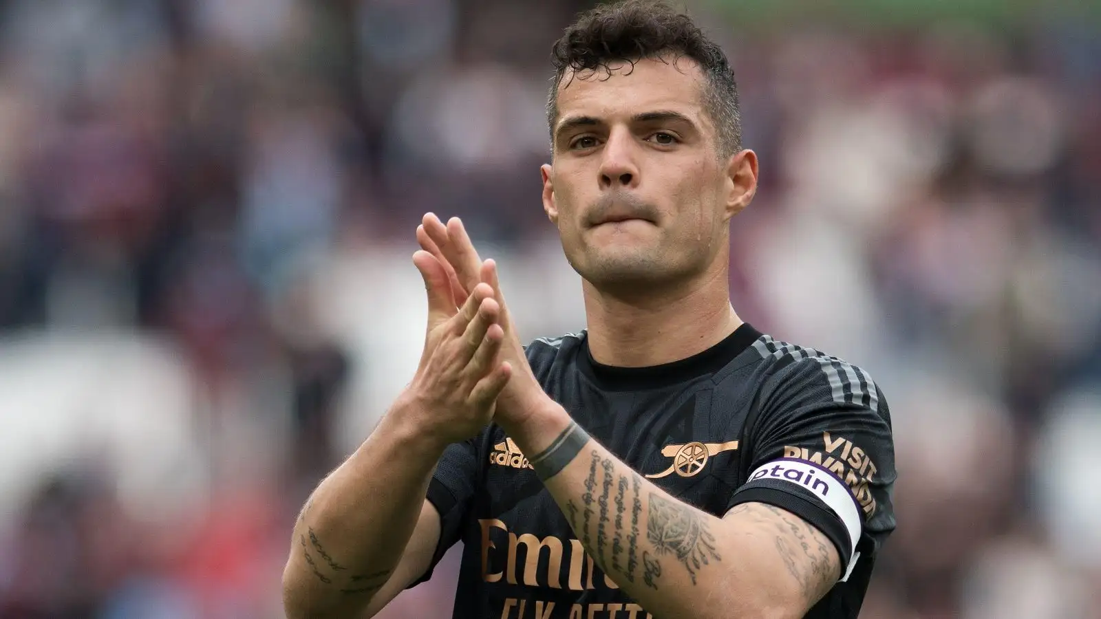 Granit Xhaka applauds the Arsenal fans after a draw against West Ham