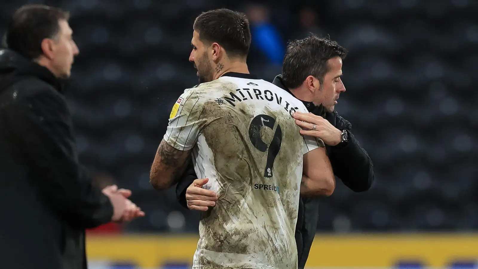 Marco Silva hugs a dirty Aleksandar Mitrovic after a game