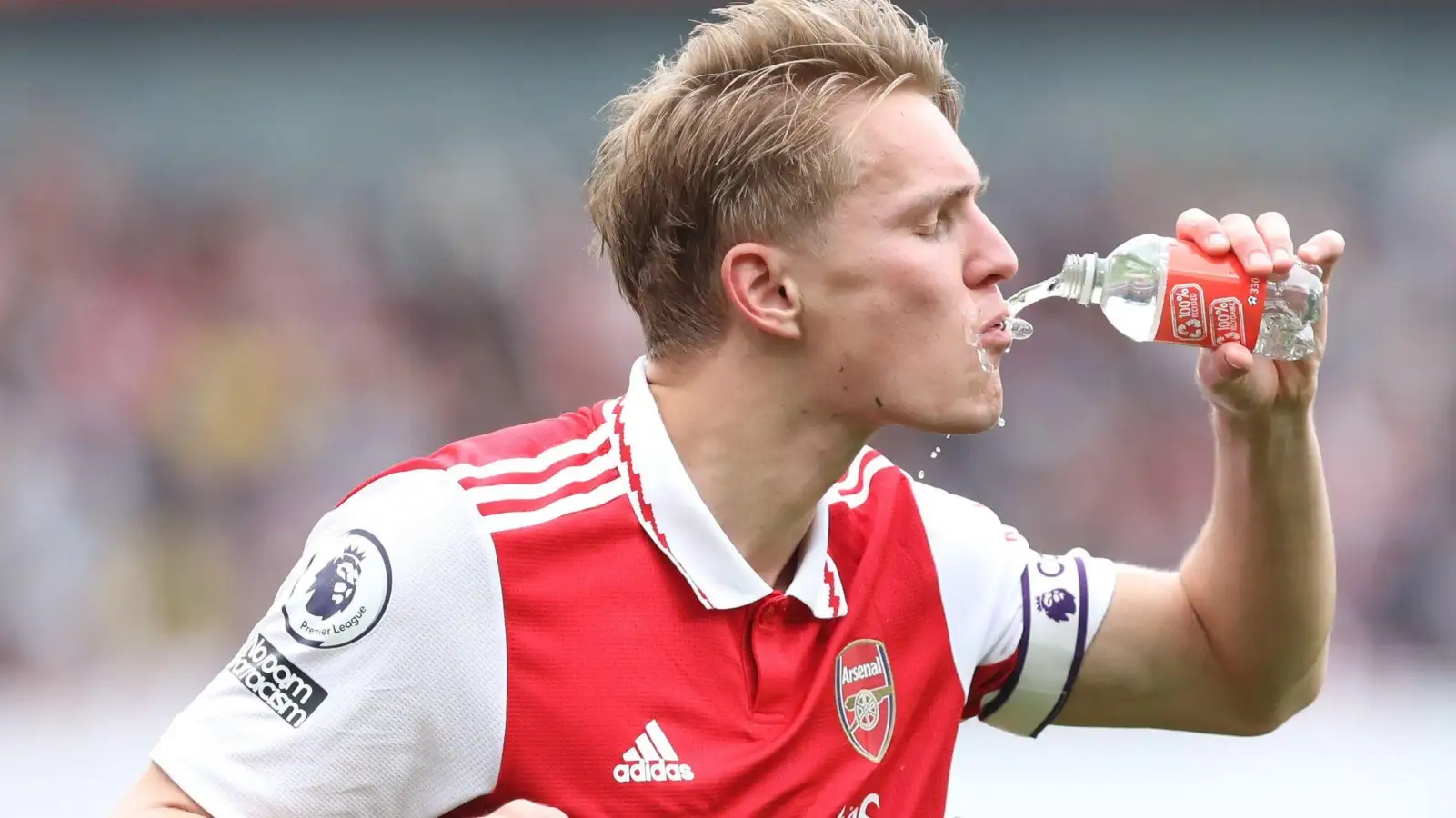 Martin Odegaard drinks from an Arsenal bottle during the defeat to Brighton.