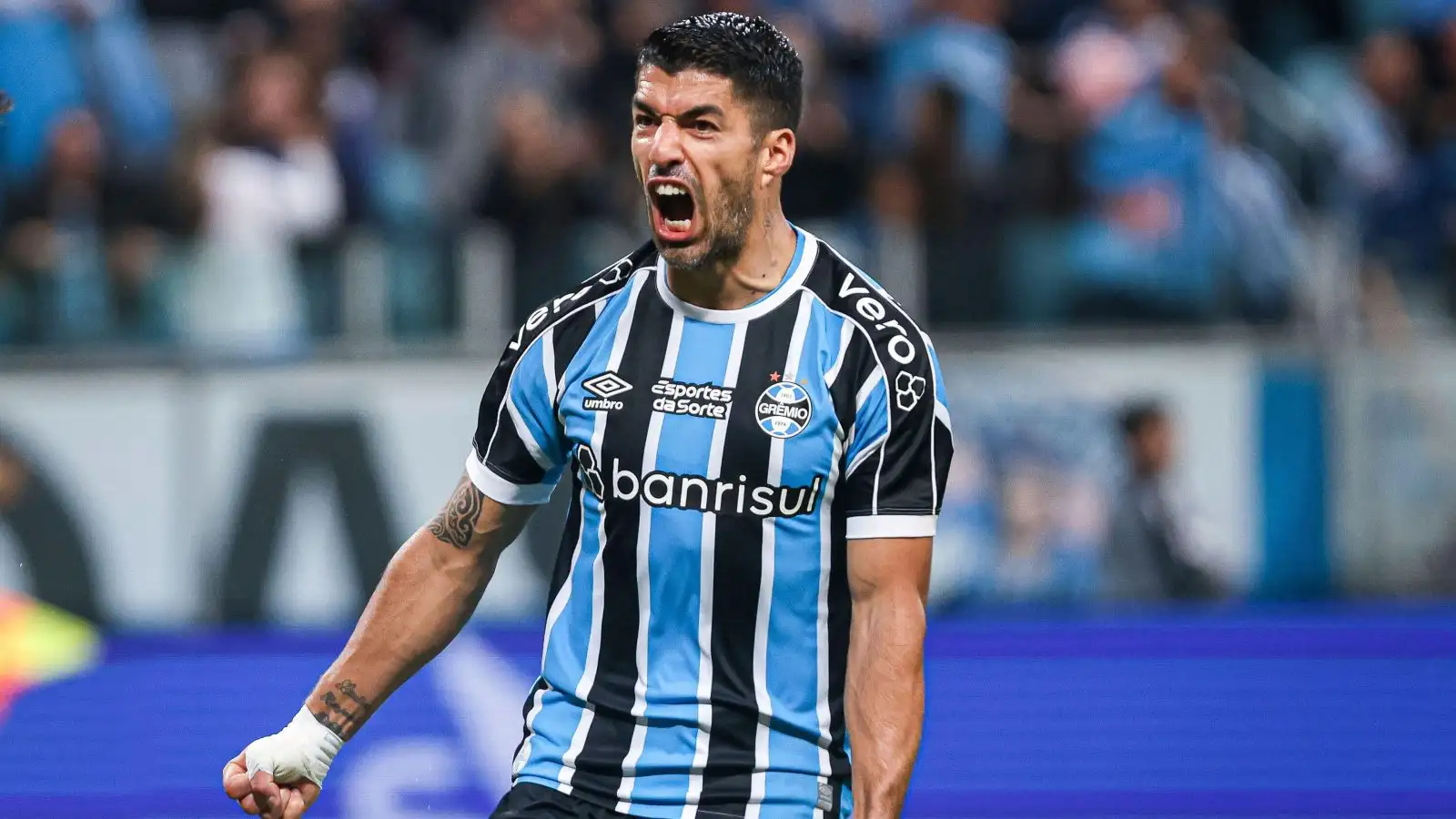 Luis Suarez, a Gremio player, celebrates his goal during a match against Cruzeiro at the Arena do Gremio stadium for the 2023 Copa do Brasil championship.