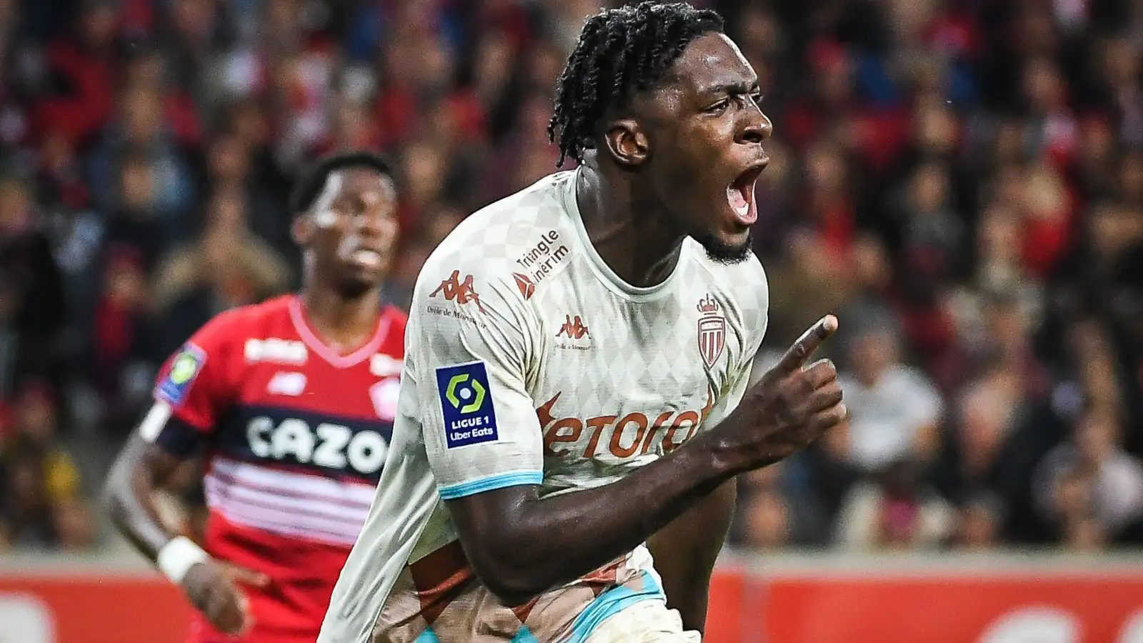 Axel Disasi celebrates after scoring for Monaco.