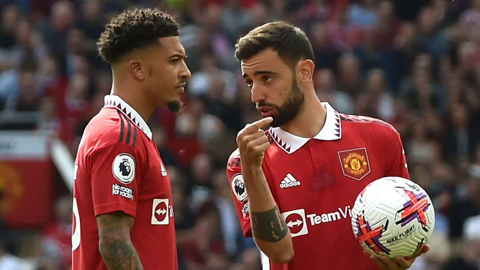 Manchester United's Bruno Fernandes, right, talks with Manchester United's Jadon Sancho during the English Premier League soccer match between Manchester United and Fulham at Old Trafford in Manchester, England, Sunday, May 28, 2023