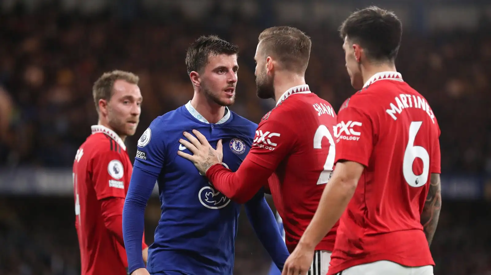 Chelsea midfielder Mason Mount clashes with Man Utd players during a Premier League game