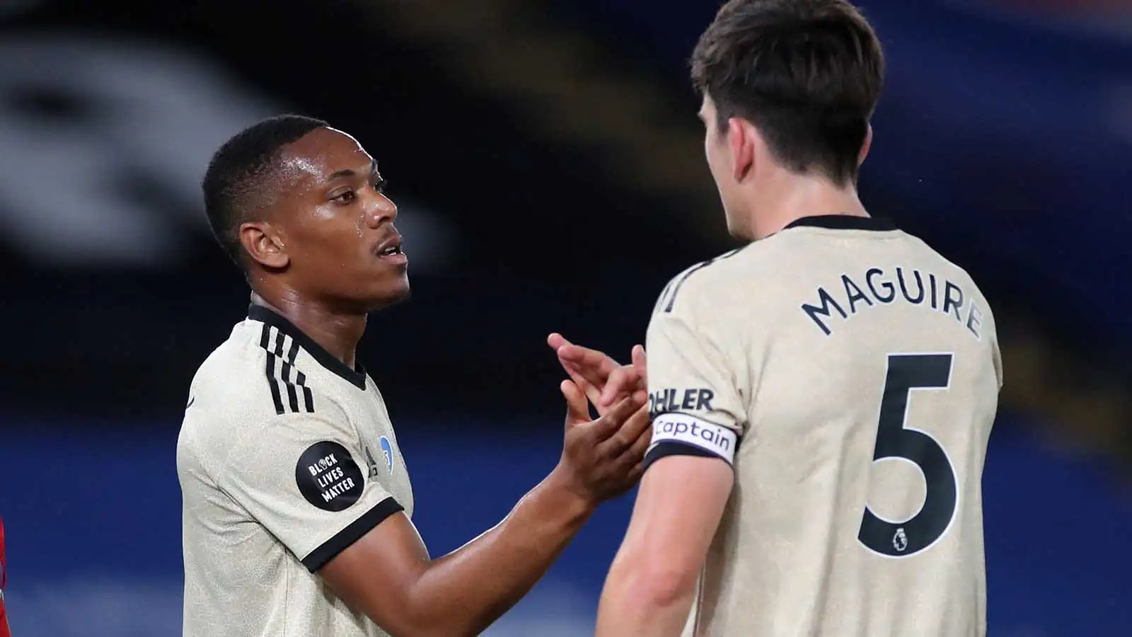 Manchester United's Anthony Martial celebrates with Harry Maguire