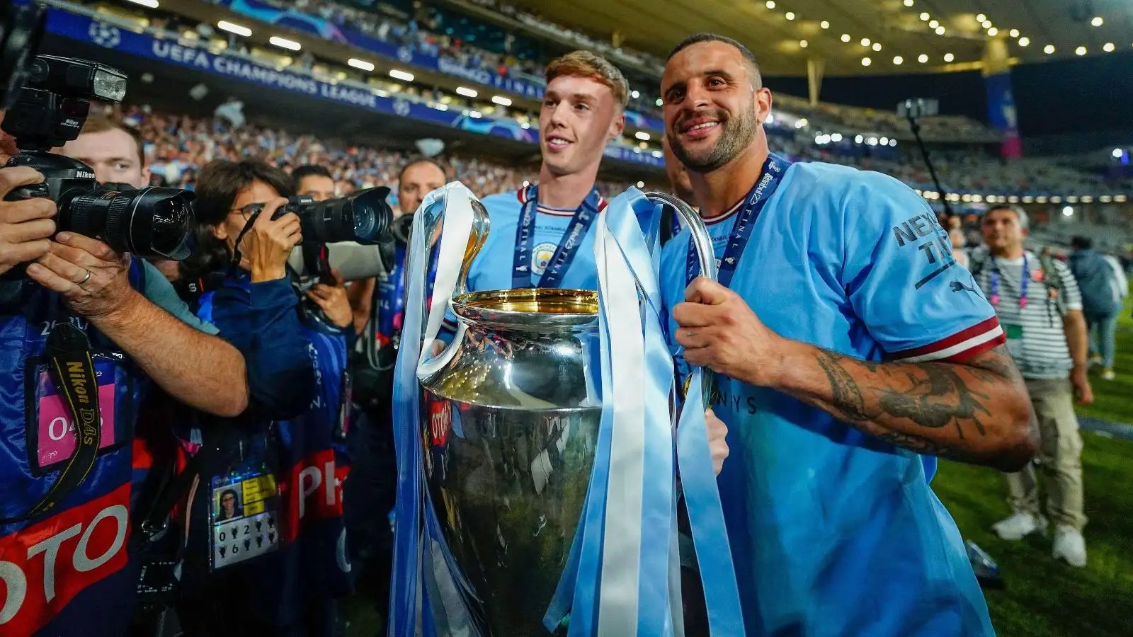 Reported Bayern Munich target Kyle Walker and Cole Palmer celebrate winning the Champions League.