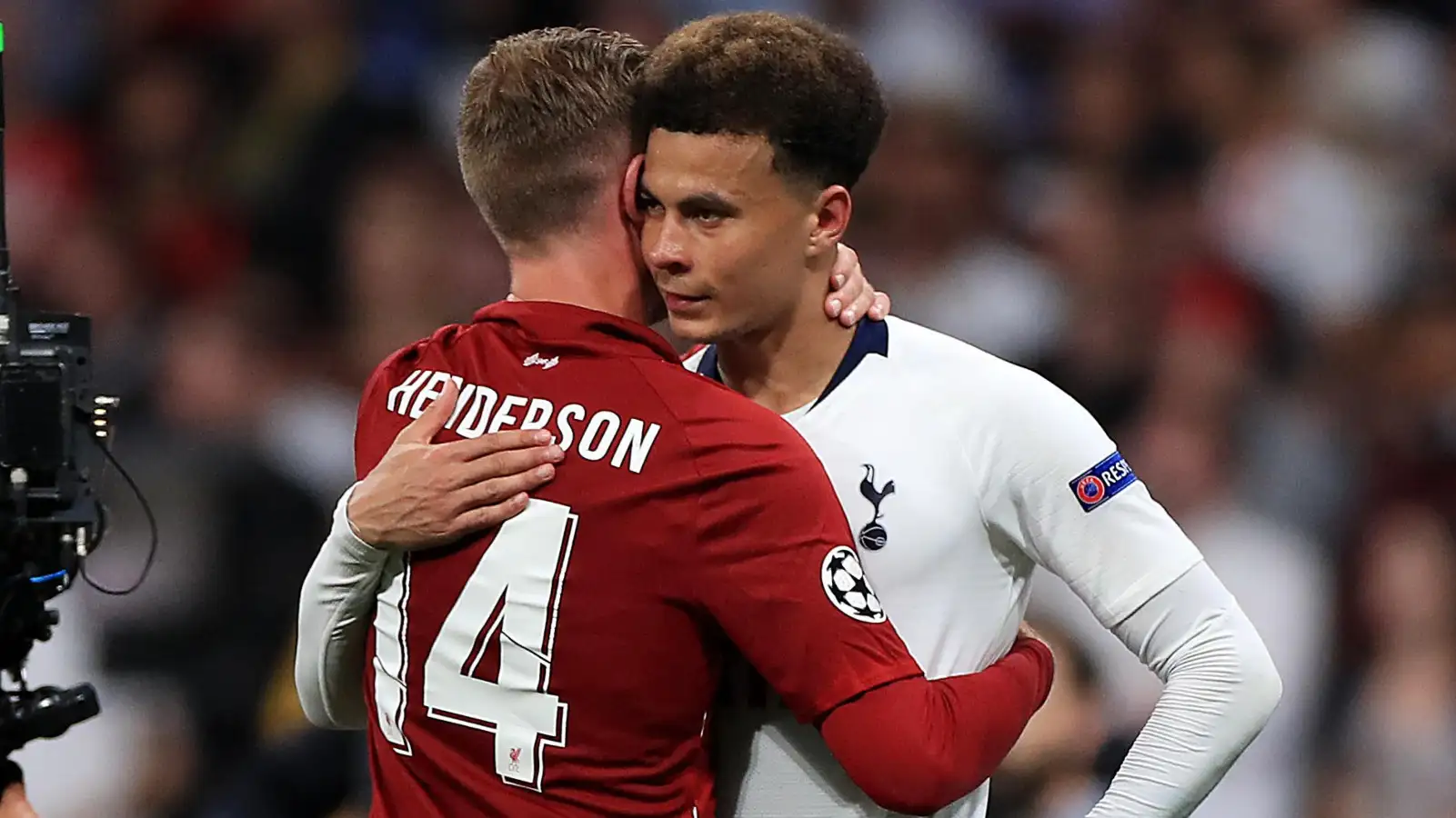 Liverpool midfielder Jordan Henderson hugs Tottenham's Dele Alli after the 2019 Champions League final.