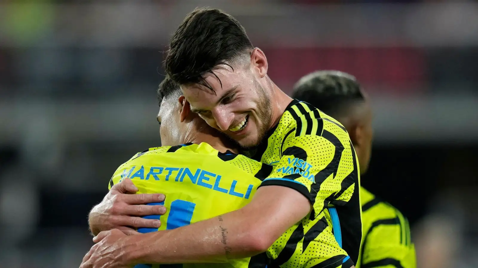 Declan Rice hugs Gabriel Martinelli during a match.