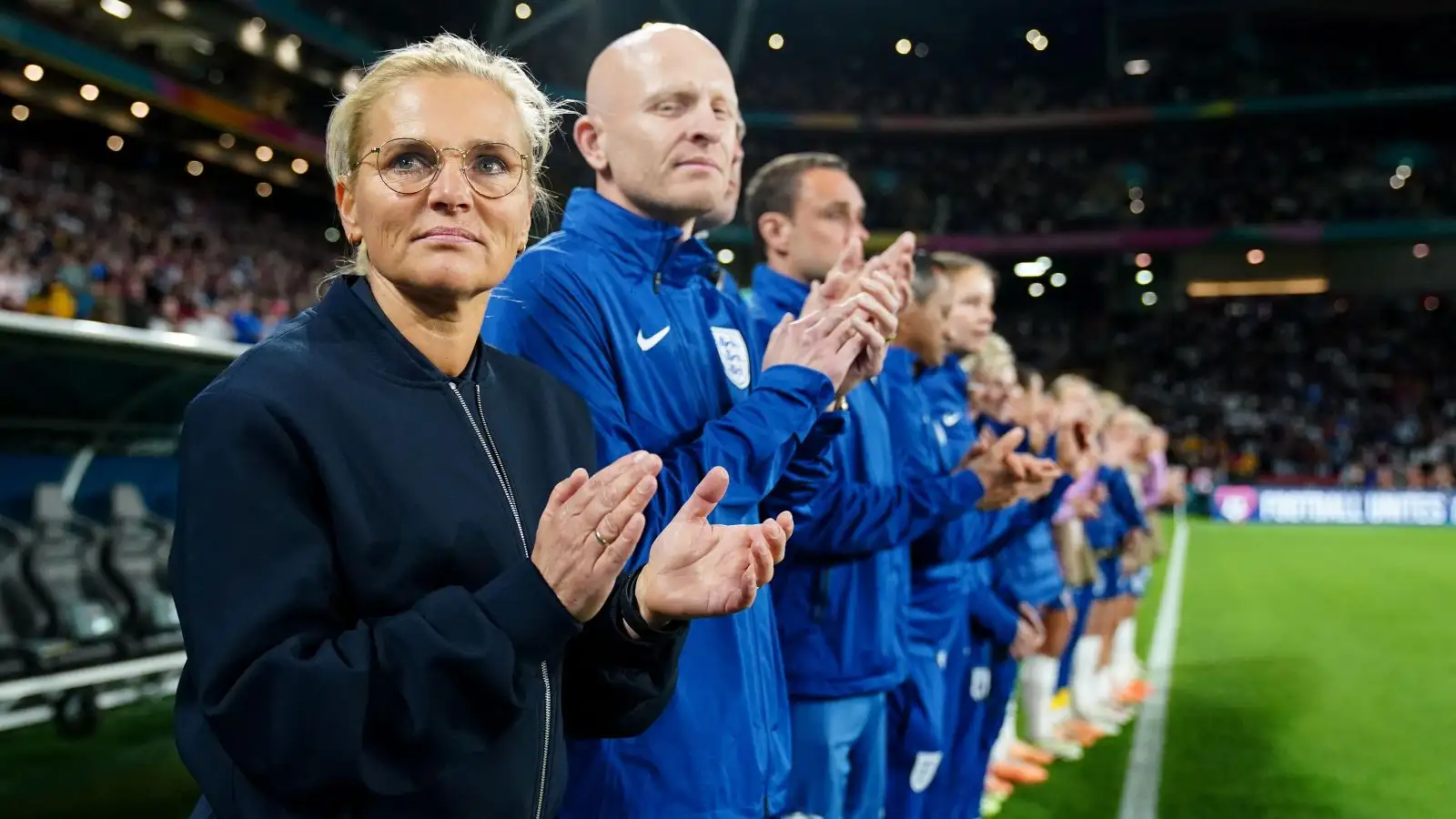 Sarina Wiegman applauds before a World Cup match.