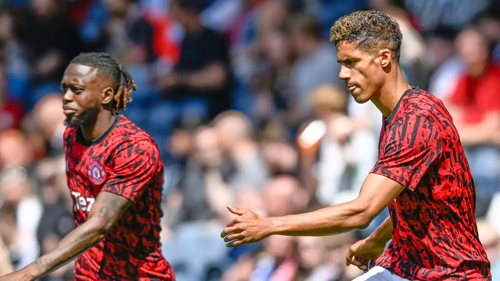 Aaron Wan-Bissaka of Manchester United and Raphael Varane