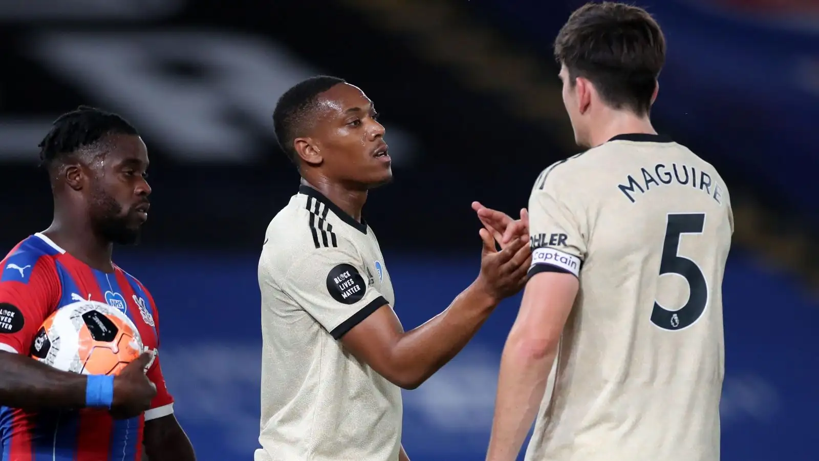 Anthony Martial and Harry Maguire celebrate a goal.