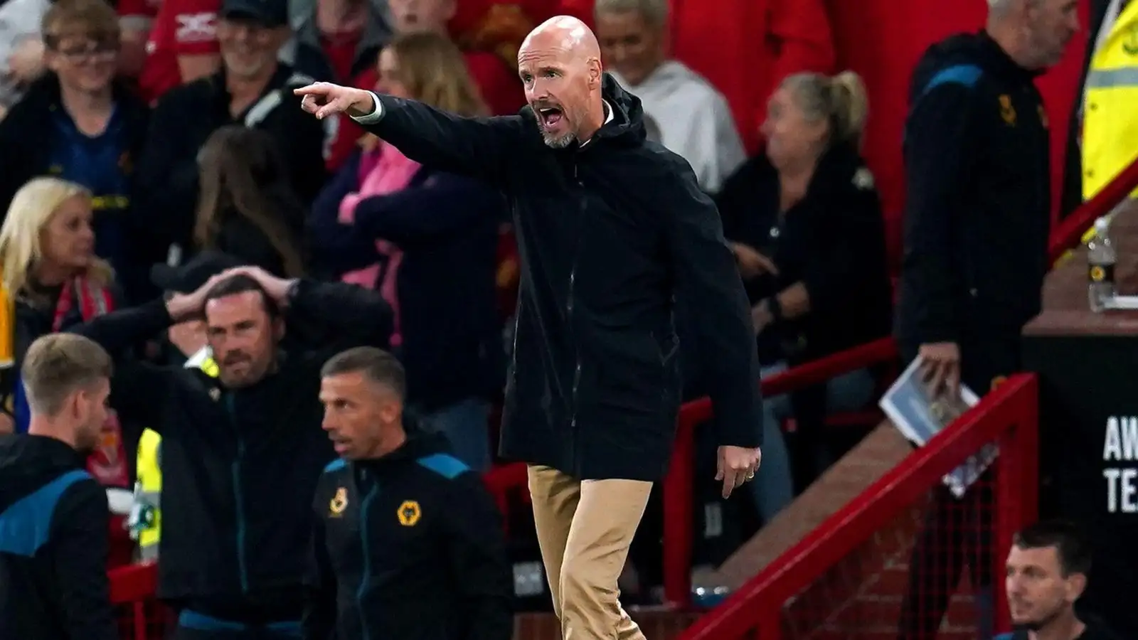 Erik ten Hag shouts at his team during a match.