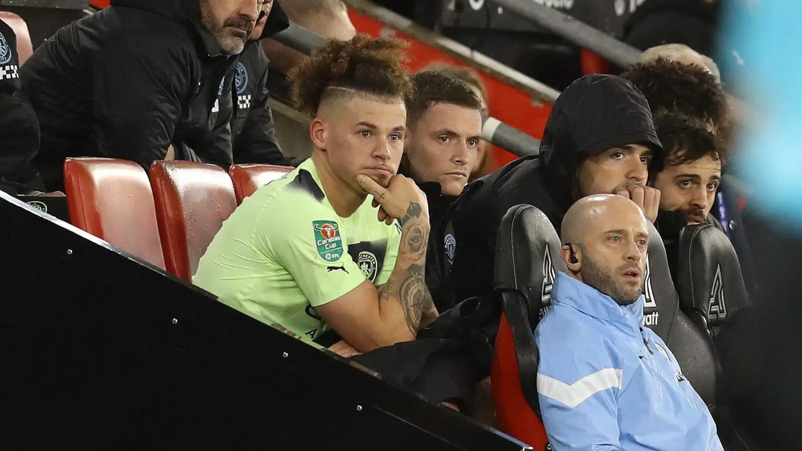 Kalvin Phillips sits down on the bench after a rare appearance for Manchester City.