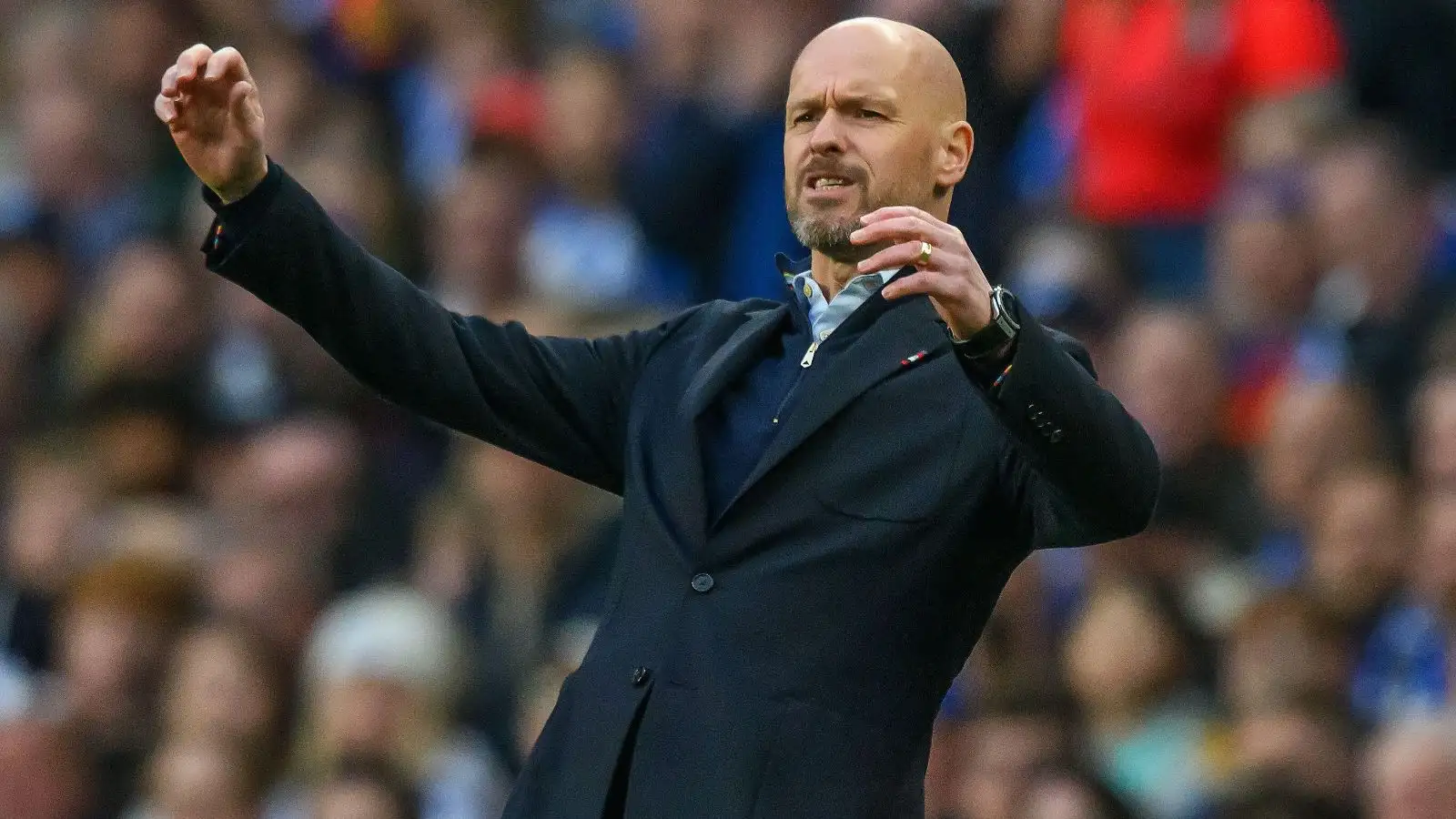 Erik ten Hag looks frustrated during a match.