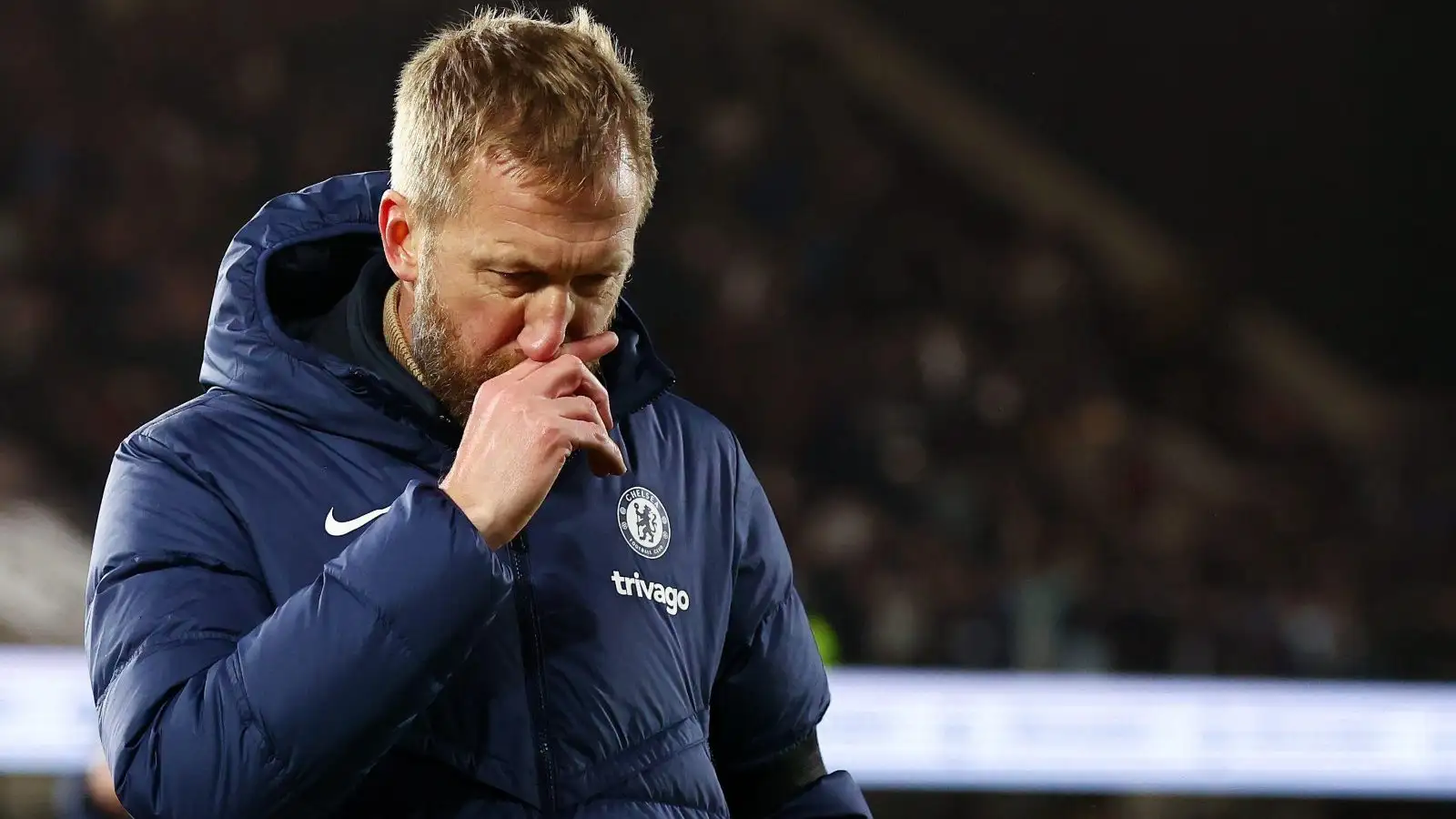 Ex-Chelsea head coach Graham Potter looks dejected during a match.