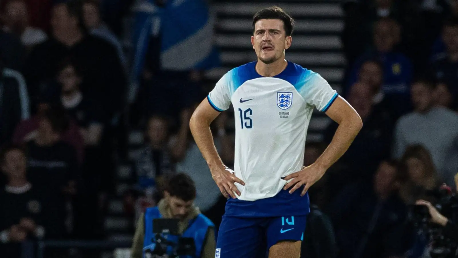 Harry Maguire looks dejected after conceding an own goal.