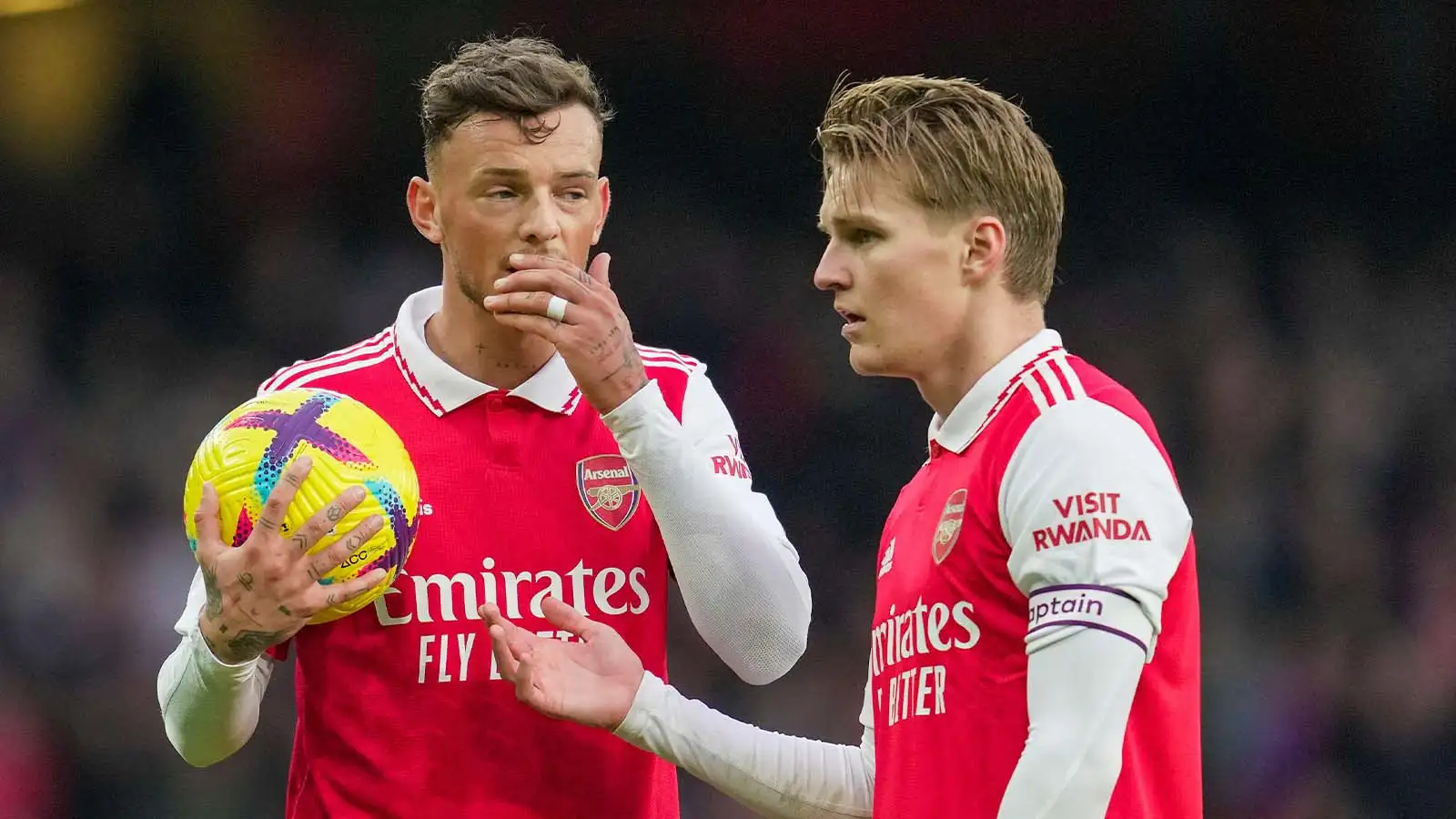 Arsenal's Ben White talks with teammate Martin Odegaard