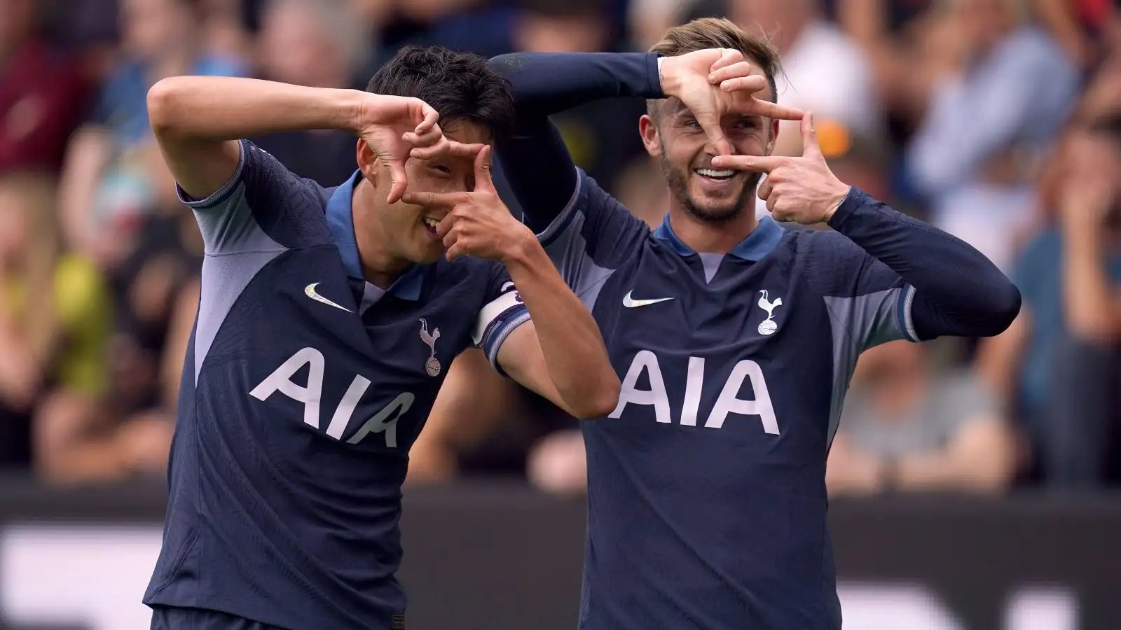 James Maddison and Heung-min Son celebrate a goal.