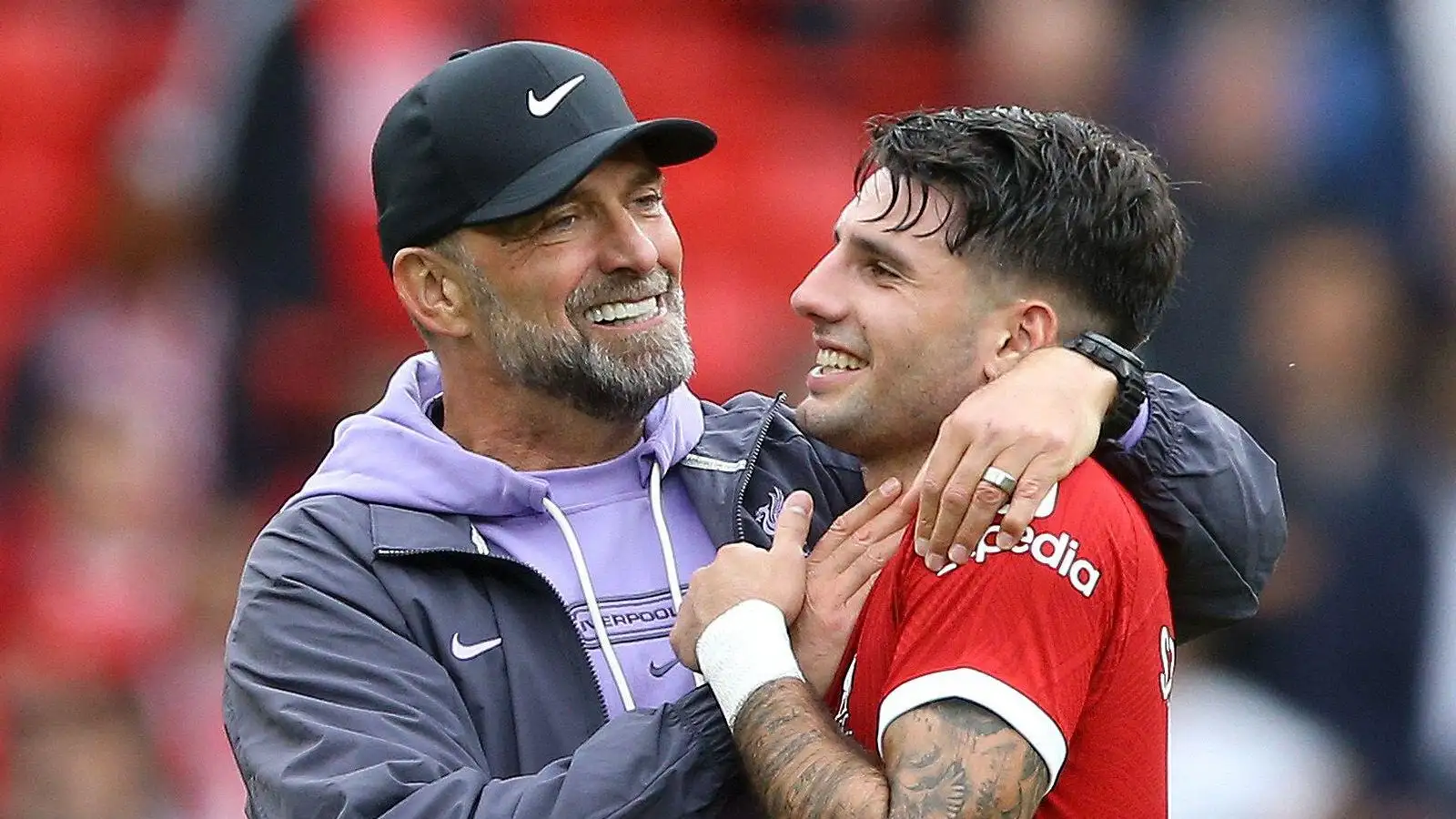 Liverpool manager Jurgen Klopp embraces midfielder Dominik Szoboszlai