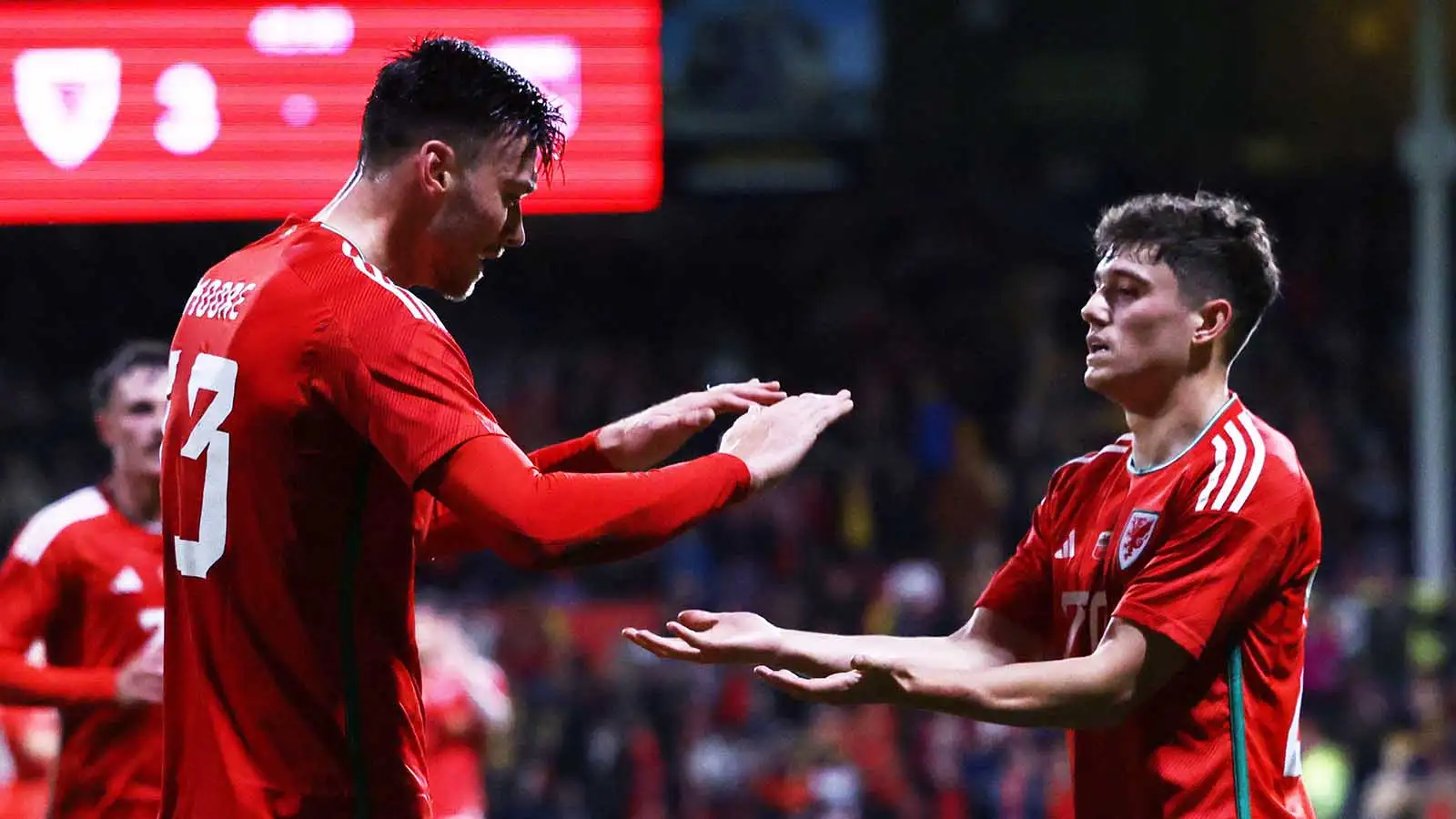 Kieffer Moore (L) celebrates his 2nd uncolored doning Daniel James