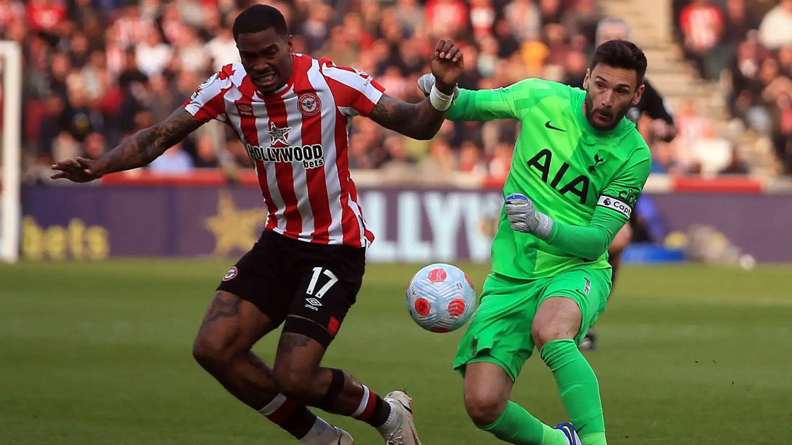 Ivan Toney settles for the ball with Hugo Lloris.
