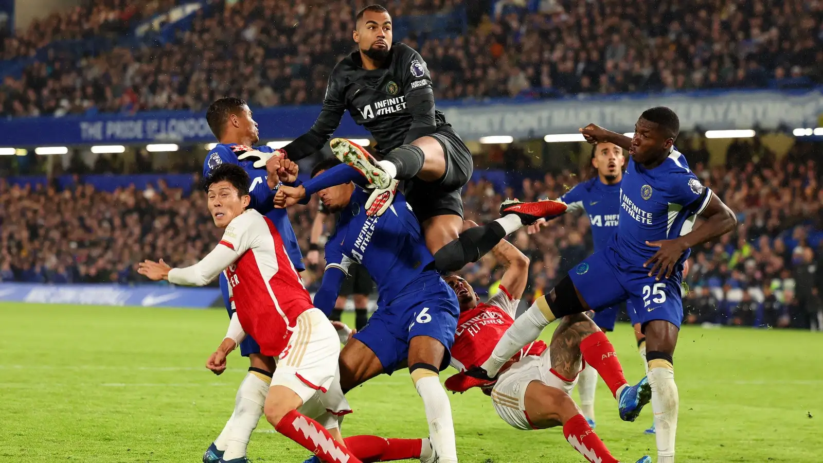 Robert Sanchez fails to gather a high ball and collides with Arsenal players and his Chelsea team-mates.