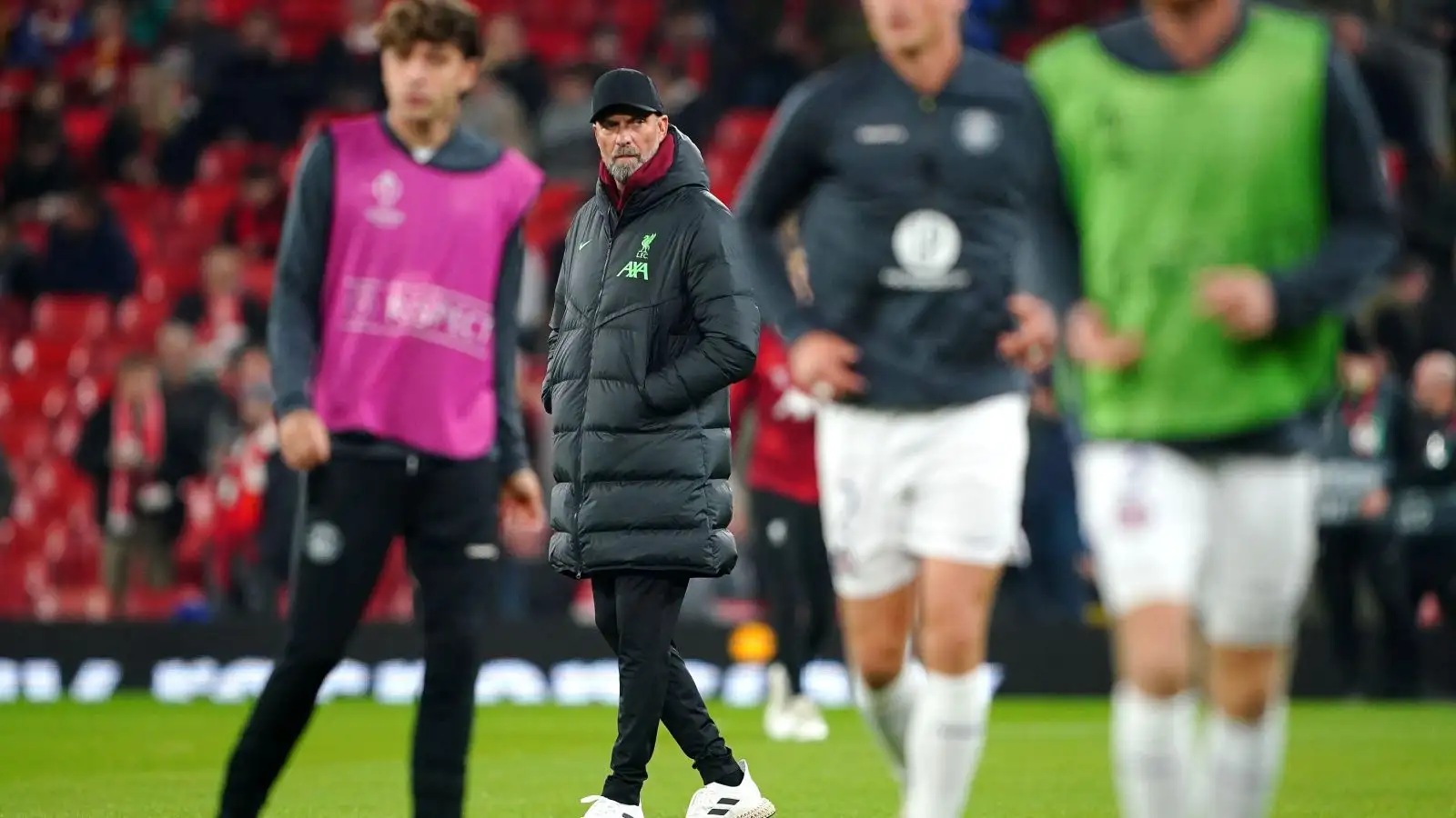 Liverpool manager Jurgen Klopp watches his players warming up.