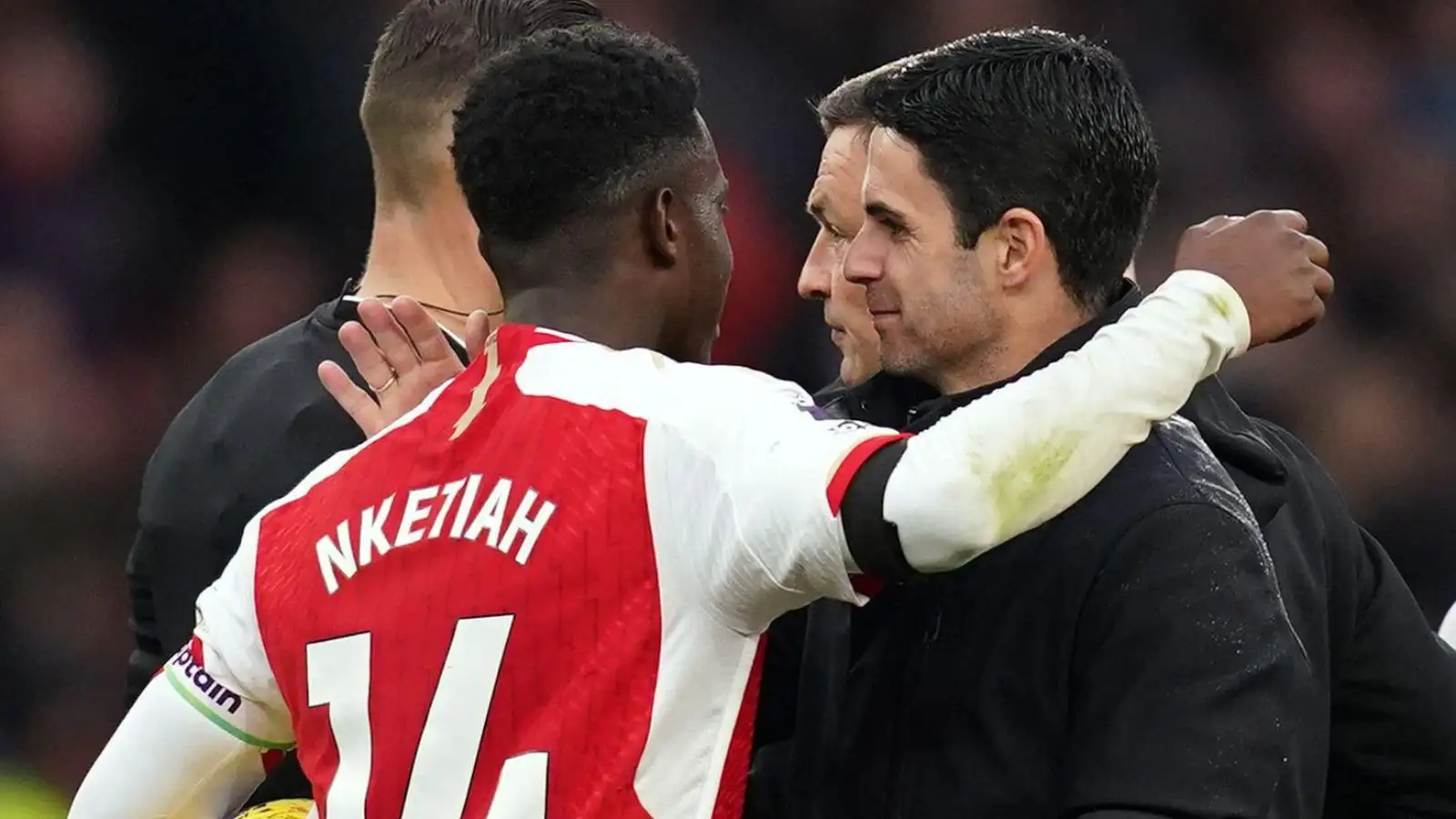 Arsenal employer Mikel Arteta hugs Eddie Nketiah after a match.