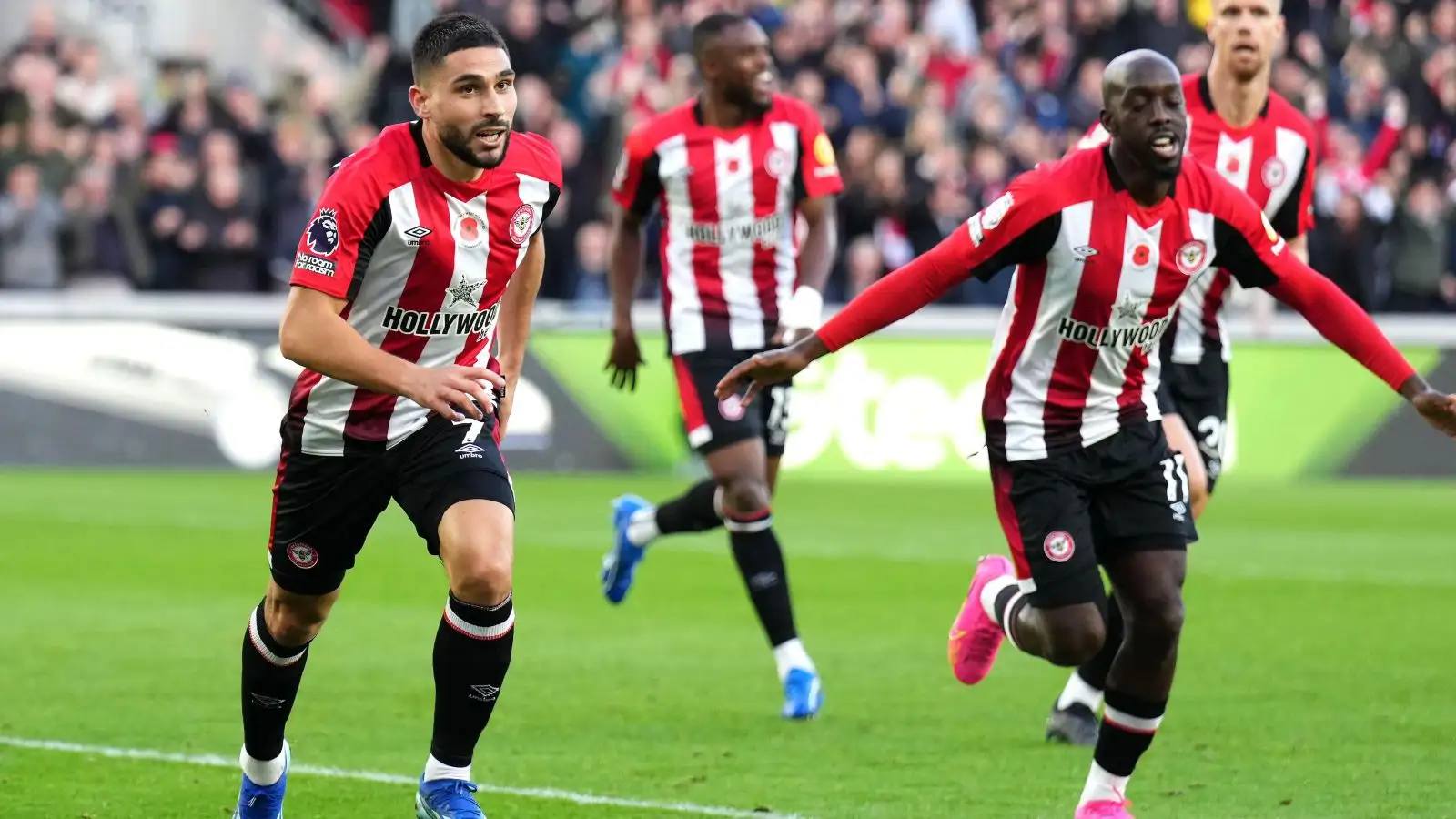 Brentford striker Neal Maupay celebrates racking up a objective.