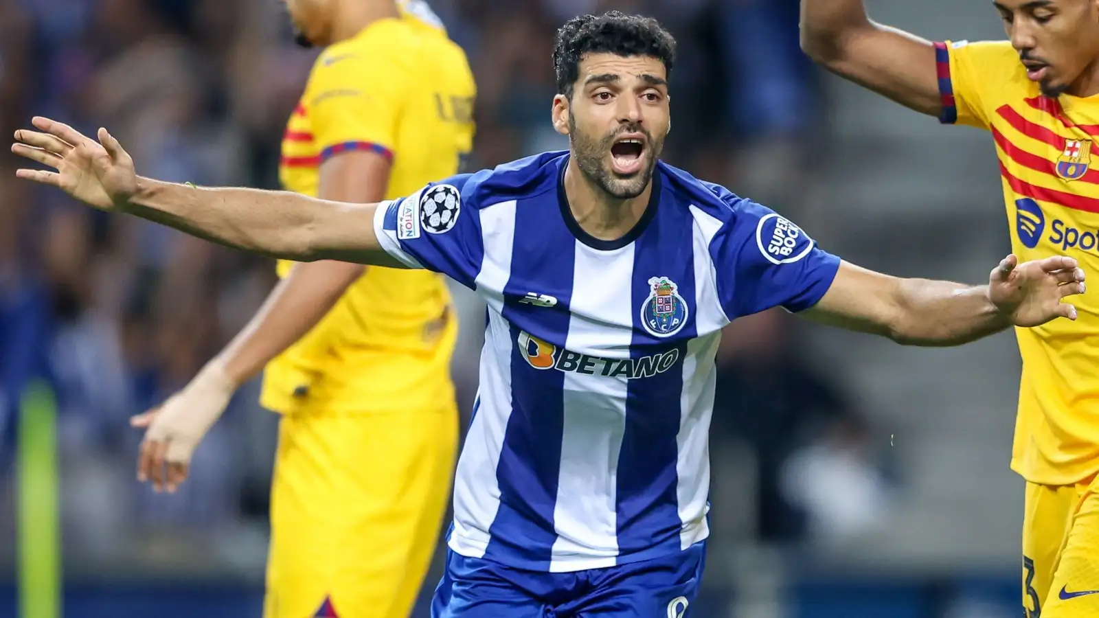 Mehdi Taremi in action for Porto against Barcelona in the Champions League.