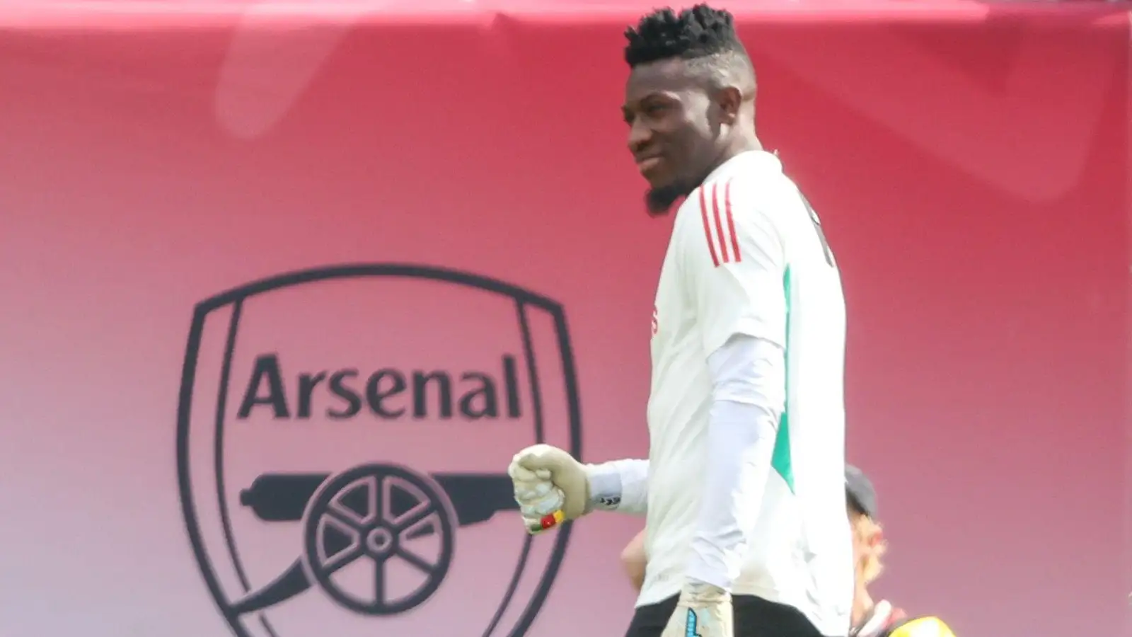 Andre Onana warms upward before Manchester Unified's pre-period cordial doning Arsenal in Favourite Jersey.
