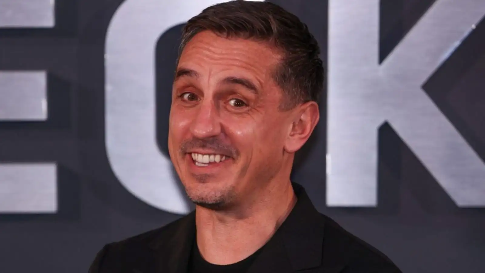 Manchester United legend Gary Neville smiling.