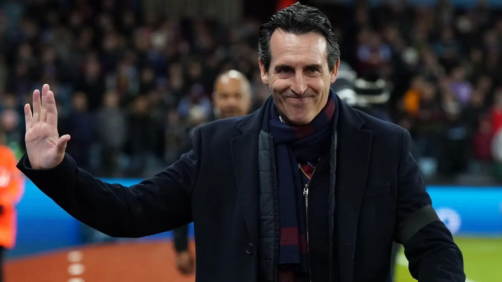 Unai Emery salutes Aston Villa fans before a game at Villa Park.