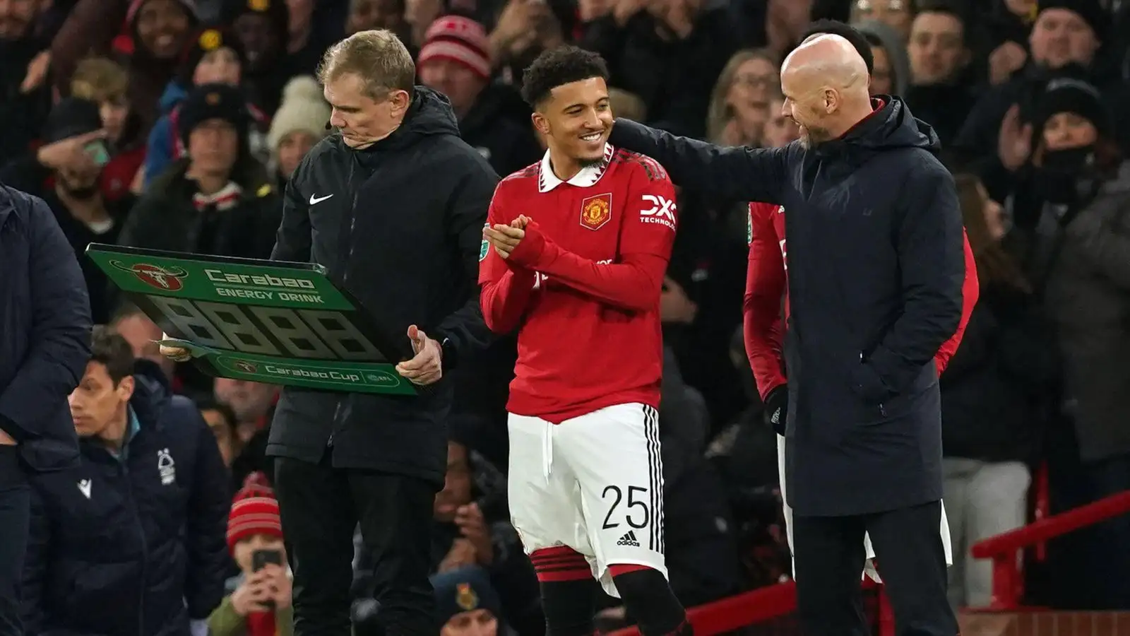 Jadon Sancho with Erik ten Hag before coming on to the pitch.