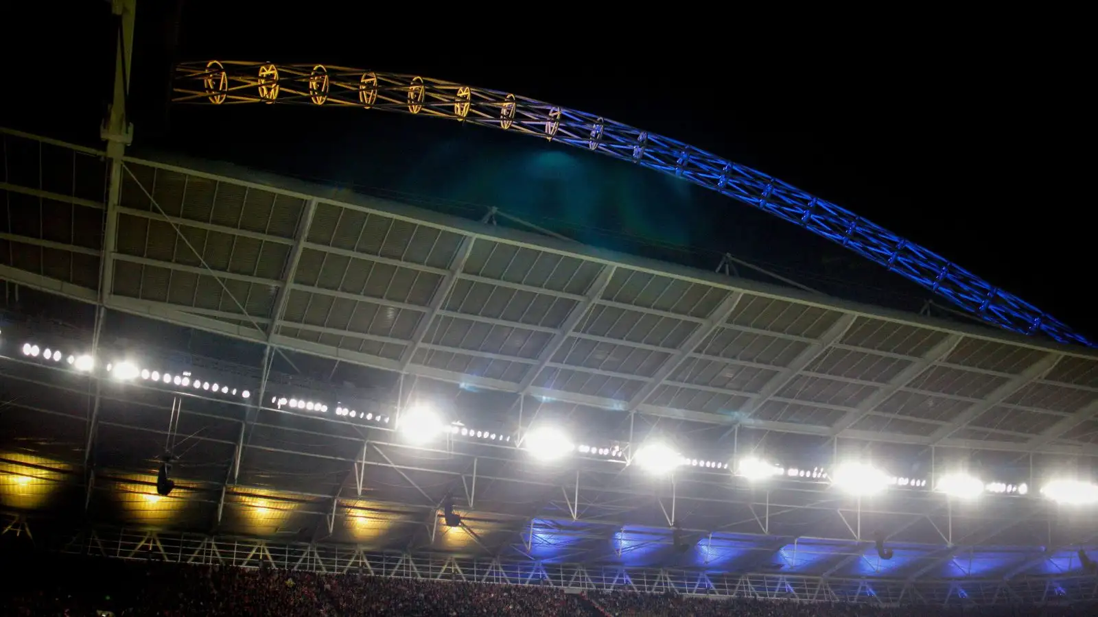 The Wembley arch lights upward in the colours of the Ukraine flag.