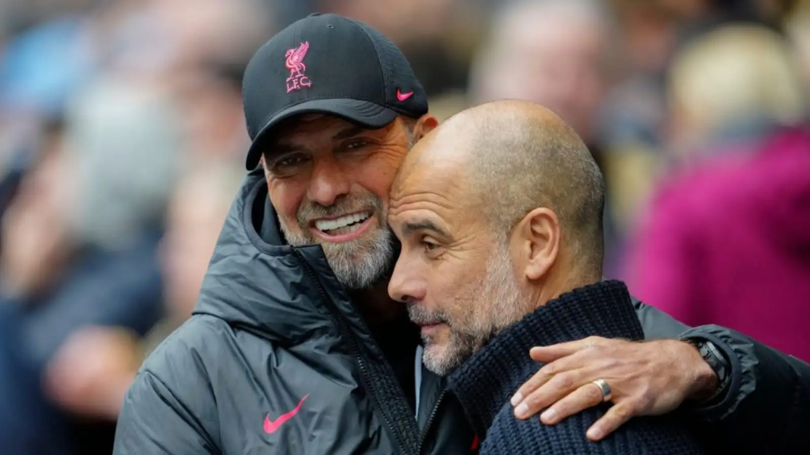 Liverpool manager Jurgen Klopp hugs Manchester City boss Pep Guardiola before a match.