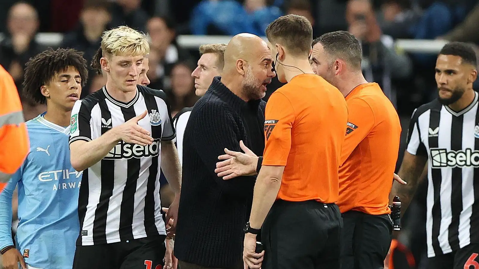 Manchester City manager Pep Guardiola debates with the referees