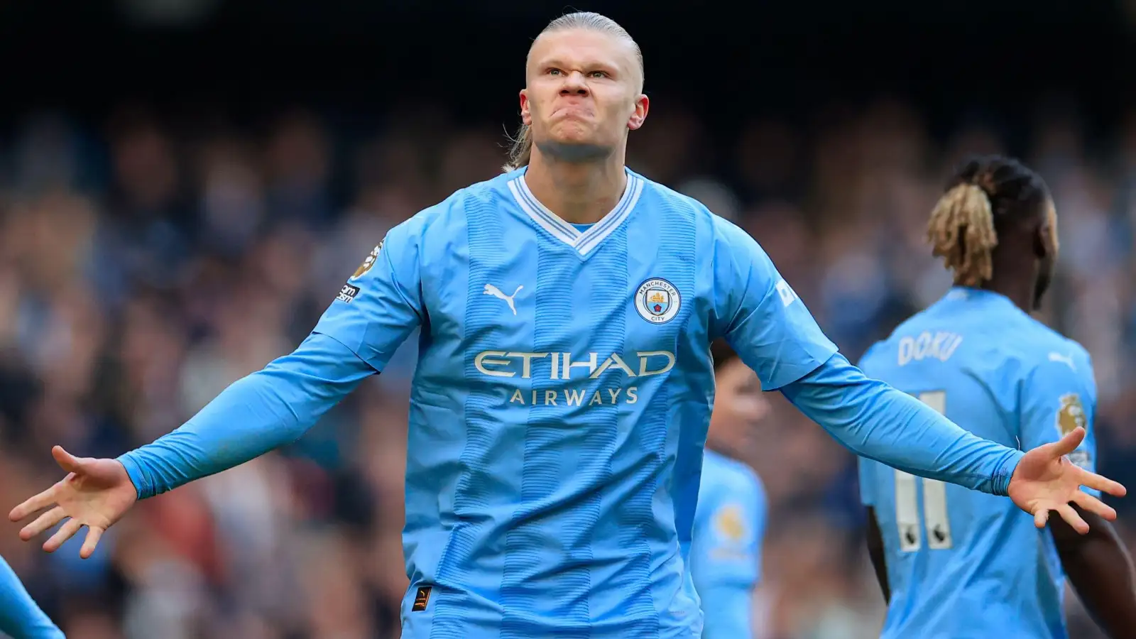 Erling Haaland celebrates the opening goal for Man City against Liverpool.