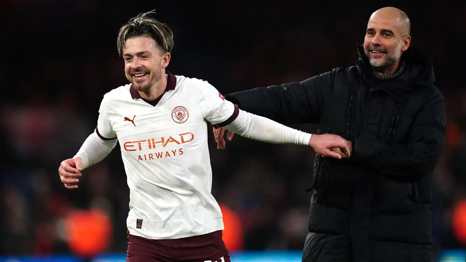 Manchester Metropolis winger Jack Grealish and Pep Guardiola after a win.