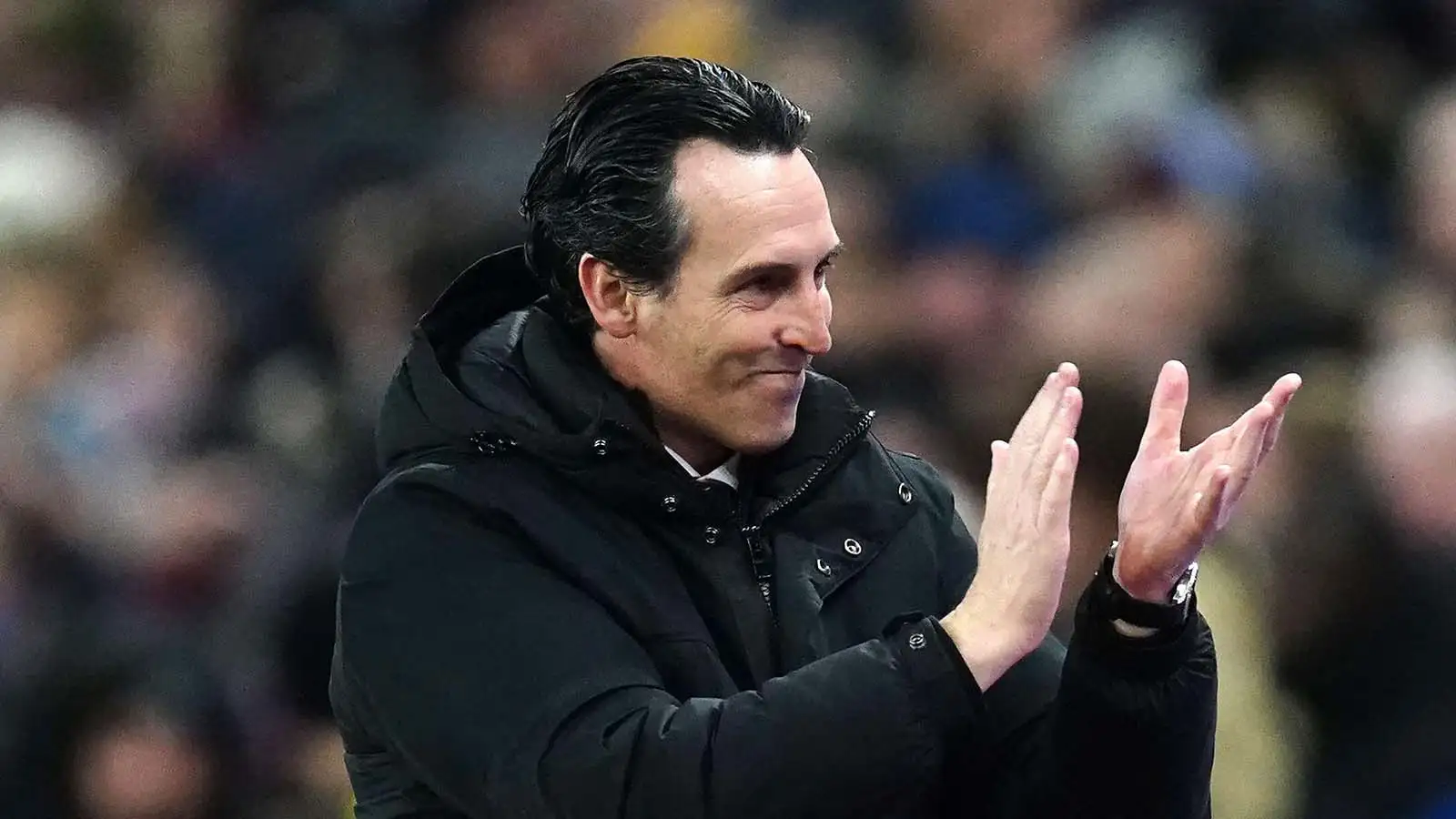 Aston Villa manager Unai Emery applauds the fans.