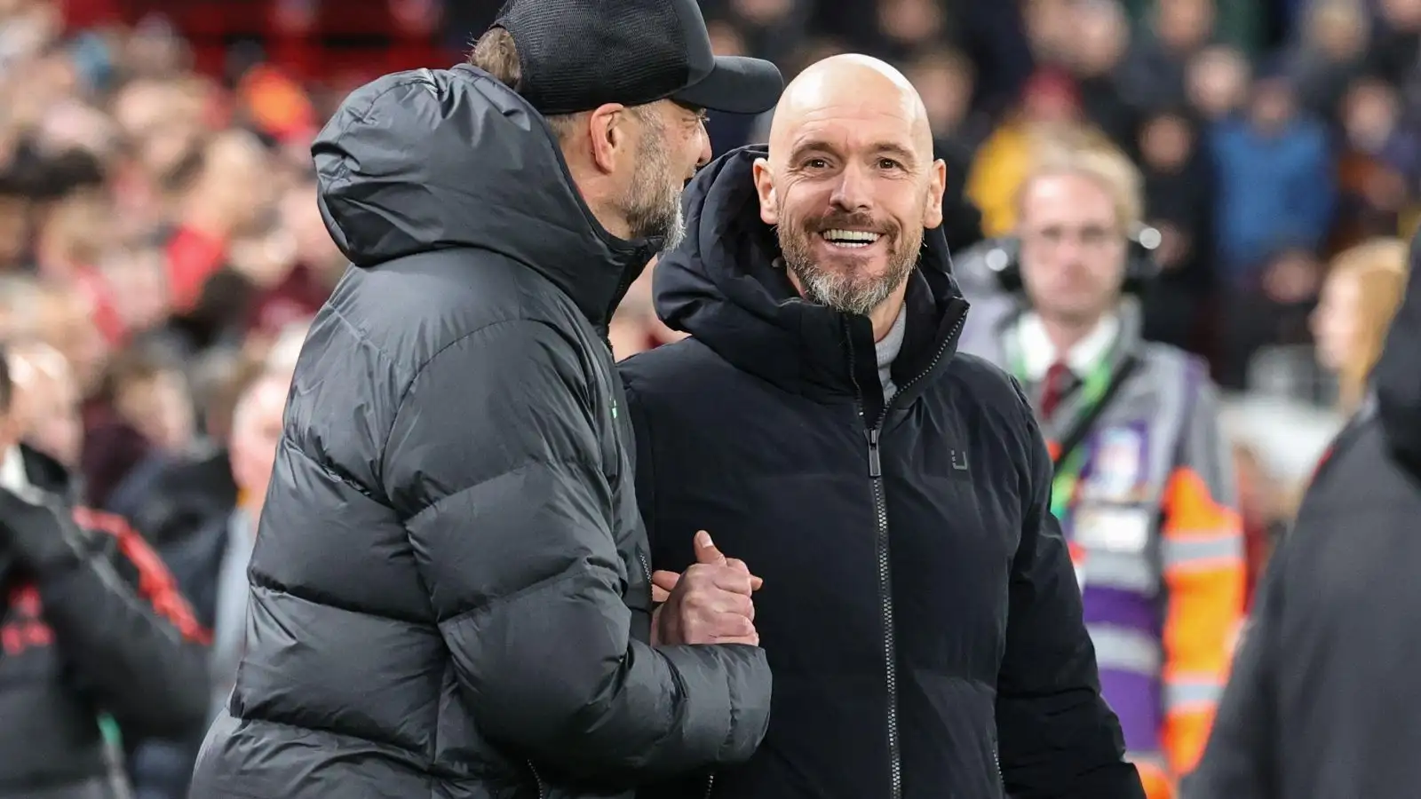 Erik ten Hag is greeted by Jurgen Klopp before a suit.