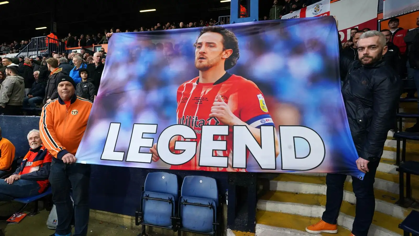 Luton Township fans grip up a banner of stabilize for Tom Lockyer.