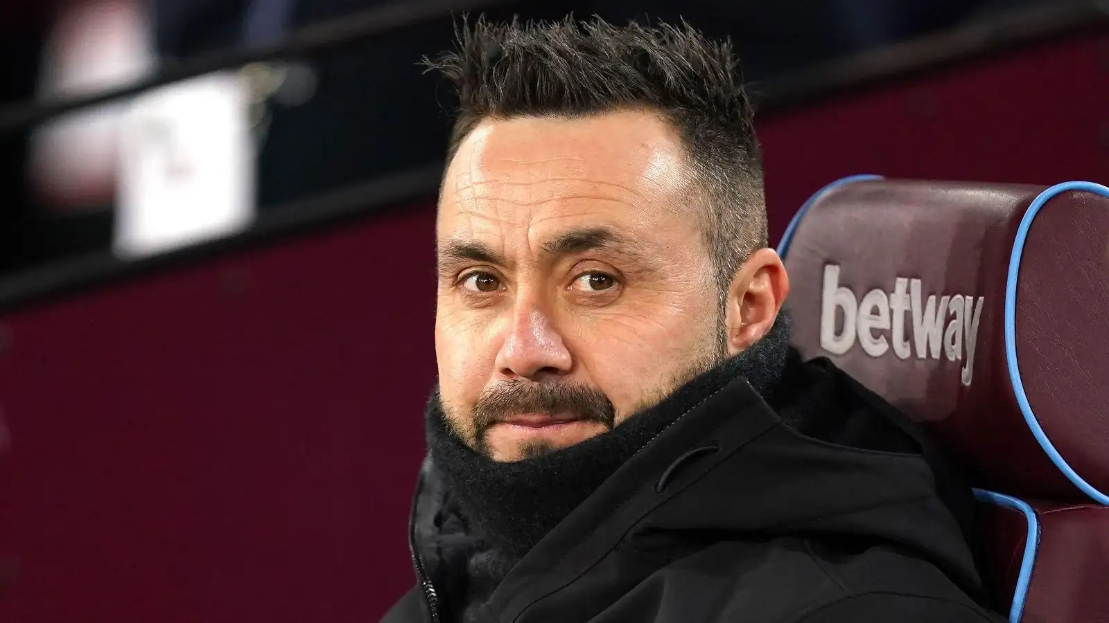 Brighton head preceptor Roberto De Zerbi sits on the bench previously a match.